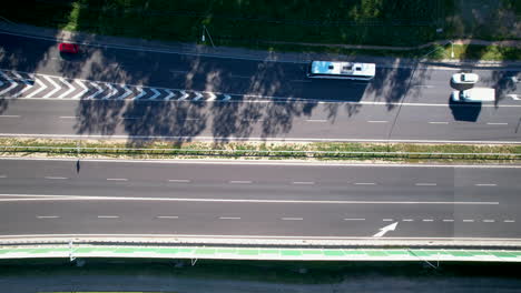 Aerial-top-down-shot-of-cars-on-highway-during-sunny-day-in-Poland,-4K