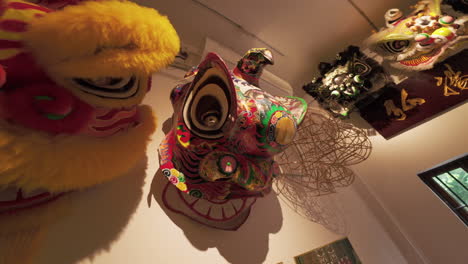 Artistic-lion-heads-for-Chinese-lion-dance-hanging-on-the-wall-of-culture-heritage-center