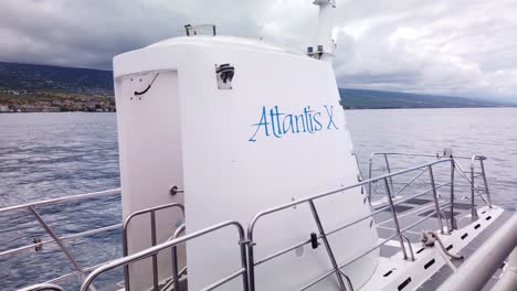 Gimbal-close-up-shot-of-the-Atlantis-X-Submarine-bobbing-in-the-open-ocean-off-the-coast-of-Kailua-Kona-in-Hawai'i