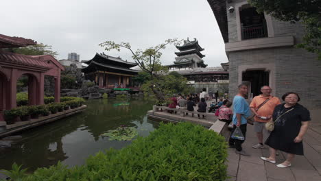 Guangzhou-Traditional-Chinese-Opera-centre-with-tourists-on-a-cloudy-day