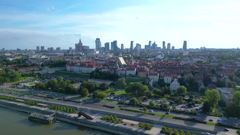 Aerial-panorama-of-Warsaw,-Poland-over-the-Vistual-river-and-City-center-in-a-distance-Old-town