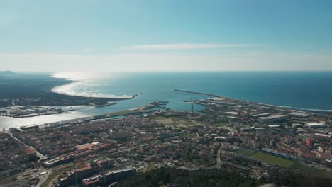 Aerial:-Viana-do-Castelo,-Portugal,-showcasing-coastal-cityscape-and-port