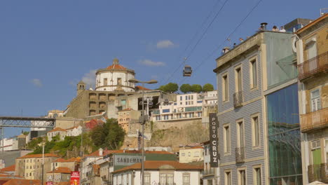 People-Walking-In-The-Street-In-Vila-Nova-de-Gaia-with-Monastery-of-Serra-do-Pilar-In-Portugal
