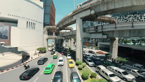 The-bustling-city-of-Bangkok-comes-alive-in-the-daytime,-as-towering-skyscrapers-and-a-vibrant-urban-landscape-paint-a-captivating-scene