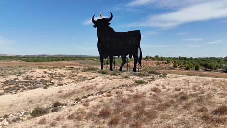 Osborne-Bull-billboard-in-Saragossa,-Spain,-in-a-sunny-summer-day