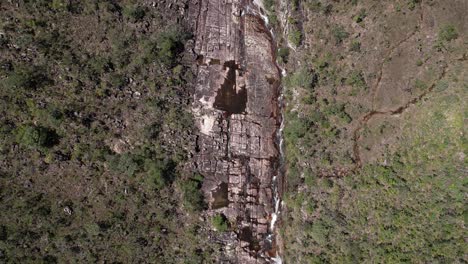 aerial-view-of-river-flowing-through-rocks,-Chapada-dos-Veadeiros-National-Park,-Goiás,-Brazil