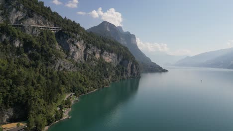 A-beautiful-day-with-sunny-weather-and-green-blue-waters-near-the-mountain-shoreline-of-Walensee