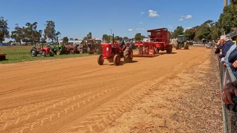 Yarrawonga,-Victoria,-Australia---7-October-2023:-Red-tractor-using-gentle-turns-as-it-pulls-the-sled-along-the-tractor-pull-track-at-the-Yarrawonga-Show-in-Victoria-Australia