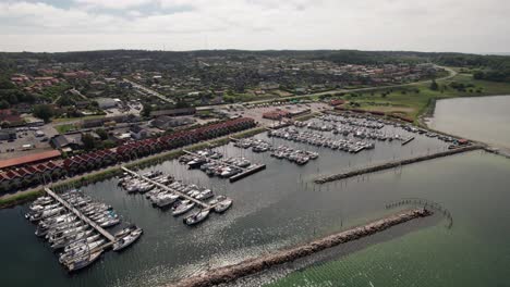 Beautiful-Harbor-in-the-Danish-Countryside,-Full-of-Sail-Boats,-Yachts-and-Boats---Aerial-Panning-Shot