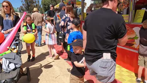 Yarrawonga,-Victoria,-Australia---7-October-2023:-People-buying-food-in-the-amusement-section-of-the-Yarrawonga-Show-in-Victoria-Australia