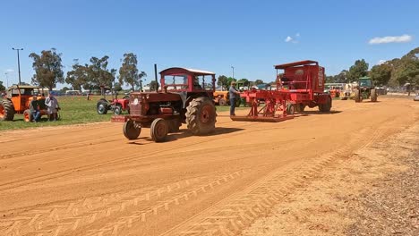 Yarrawonga,-Victoria,-Australia---7-October-2023:-Old-tractor-with-early-enclosed-cabin-pulling-the-sled-at-a-tractor-pull-event-at-the-Yarrawonga-Show-in-Victoria-Australia