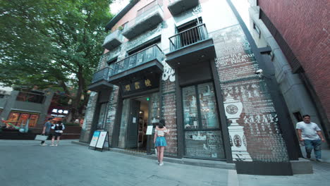 Stylized-building-decorated-with-glass-panels-on-top-of-brick-walls