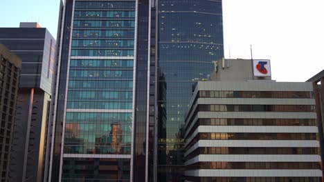 Handheld-tilt-up-shot-capturing-the-exterior-of-Telstra-One-building-at-downtown-Brisbane's-central-business-district-CBD,-Queensland,-Australia's-largest-telecommunication-service-provider