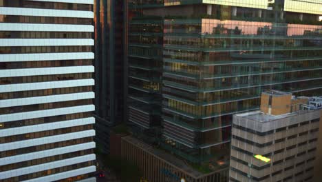 Handheld-tilt-down-shot-capturing-the-building-exterior-of-Suncorp-head-office-at-the-heritage-laneway-on-80-Ann-street,-downtown-Brisbane-city,-Queensland,-Australia