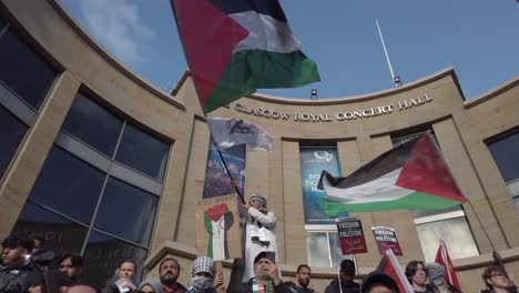 A-young-man-flew-the-Palestine-at-a-protest