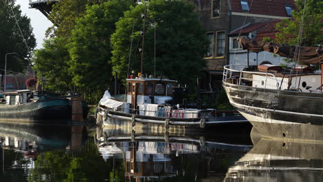 Old-Harbor-With-Boats-In-Gouda,-The-Netherlands---wide