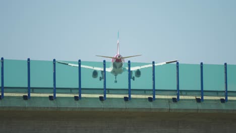 A-passenger-plane-is-landing-above-the-highway