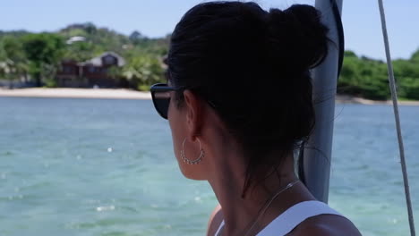 Closeup:-Pretty-Latina-enjoys-view-of-Roatan-shoreline-from-boat-ride
