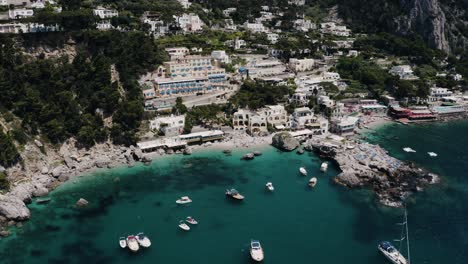 Aerial-view-pulling-away-from-Marina-Piccola-in-Capri,-Italy