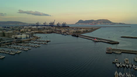 Aerial-view-of-the-industrial-port-of-Isla-Verde,-sunset-in-Algeciras,-Spain