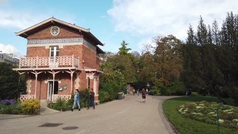 People-Walk-in-Paris-at-Park-de-Buttes-Chaumont-Autumn-Sunny-Day