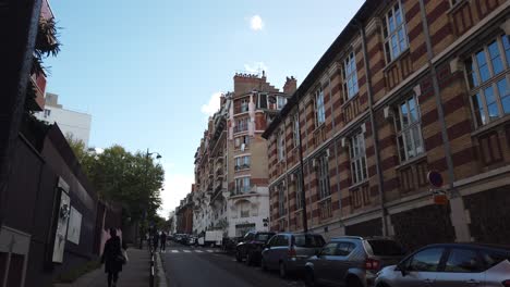 Paris-Streets-in-Autumn-People-Walk-around-Vintage-Traditional-Apartments-Facade