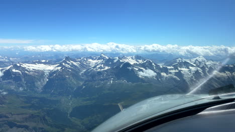 View-from-airplane-cockpit-to-breathtaking-mountain-scenery-of-The-Alps