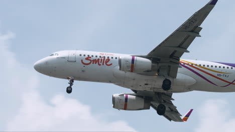 Thai-Smile-Airways-prepares-for-Landing-at-Suvarnabhumi-Airport,-Thailand