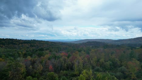 Drone-flight-on-a-rainy-day-over-the-woods-in-colorful-fall-foliage-in-Western-Massachusetts