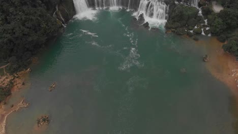 Tilt-up-shot-of-big-ban-gioc-waterfalls-at-Vietnam,-aerial