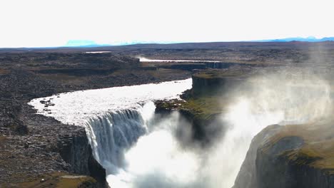 Huge-Gullfoss-waterfall,-the-violence-of-the-waterfall-makes-a-cloud-of-mist-water
