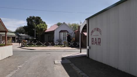 Slow-pan-in-narrow-street-of-Kimberley-mine-restored-Old-Town-Museum