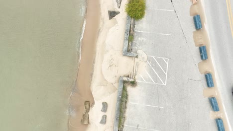 An-endangered-shoreline-buffed-with-various-measures-to-keep-the-sand-in-place
