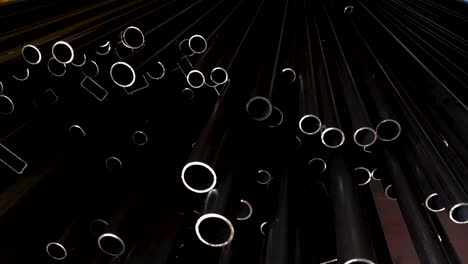 Stack-of-black-metal-pipes.-Shiny-black-pipe