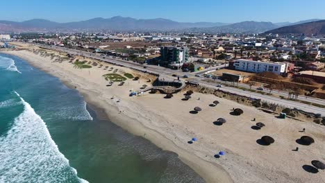 Drone-shot-of-a-Mexican-city-next-to-the-beach-“Ensenada??