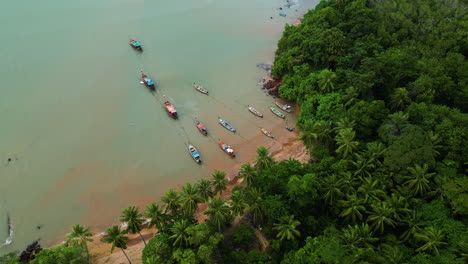 Aerial-top-down-shot-of-asian-fisherman-boats-at-beach-of-Koh-lanta-Island,-Thailand
