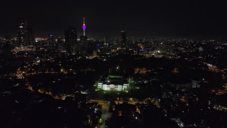 Colombo-Sri-Lanka-Aerial-v39-drone-flyover-Kurunduwatta-across-National-museum-and-Viharamahadevi-park-capturing-downtown-cityscape-featuring-lotus-tower-at-night---Shot-with-Mavic-3-Cine---April-2023