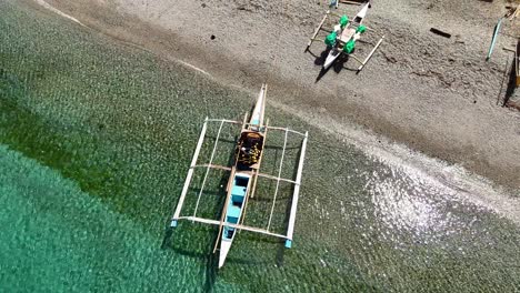 Banka-coastal-fishing-boats-on-the-shores-of-Ipil,-Surigao-Del-Norte-aerial