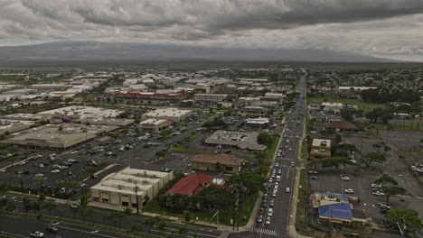 Kahului-Maui-Hawaii-Aerial-v5-establishing-shot-drone-flyover-city-center-capturing-local-townscsape,-street-traffics-and-airport-views-on-a-cloudy-day---Shot-with-Mavic-3-Cine---December-2022