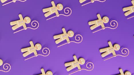 Gingerbread-Men-and-Candy-Canes-on-a-purple-background-vertical