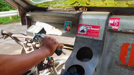 Close-up-of-driving-Filipino-tricycle-taxi-motorbike-in-Palawan,-Philippines,-Southeast-Asia