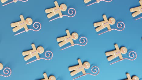 Gingerbread-Men-and-Candy-Canes-on-a-blue-background-vertical
