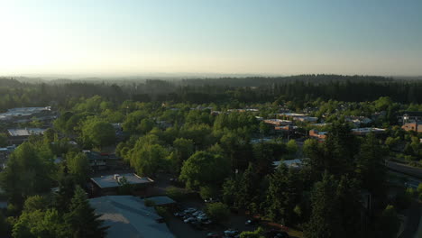 Aerial-view-flying-low-over-a-town-in-Oregon,-sunny-summer-evening-in-USA