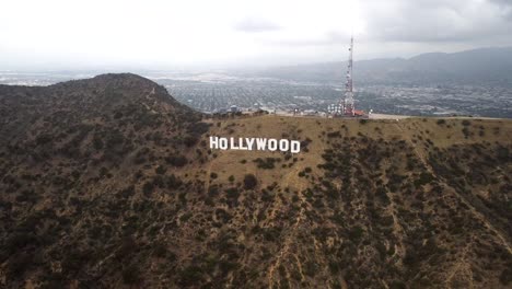 Hollywood's-iconic-logo-atop-the-Los-Angeles-mountains-stands-as-a-beacon-of-the-entertainment-industry,-symbolizing-fame-and-cinematic-dreams