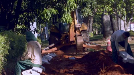 Slow-motion-footage-of-workers-and-machinery-at-city-construction-site