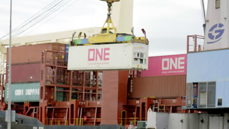 panning-shot-of-a-container-gantry-crane-on-a-cargo-rail,-customs