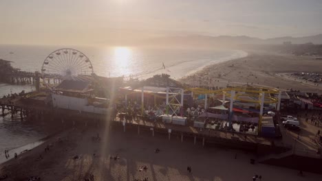 A-silhouette-capture-of-Santa-Monica-recreational-park-with-the-sun-setting-sun-in-the-background