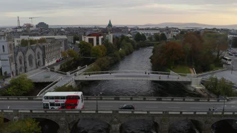 Cinematic-shot-of-Galway-featuring-the-Corrib,-bridges-and-the-abbey