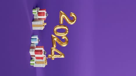 Celebrando-El-2024-Con-Globos-Dorados-Y-Regalos-Sobre-Fondo-Morado-Vertical