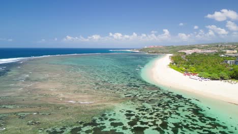 Aerial-over-the-Tropical-and-Paradisiacal-Beach-and-Reef-of-Nusa-Dua-in-Bali,-Sunny-day